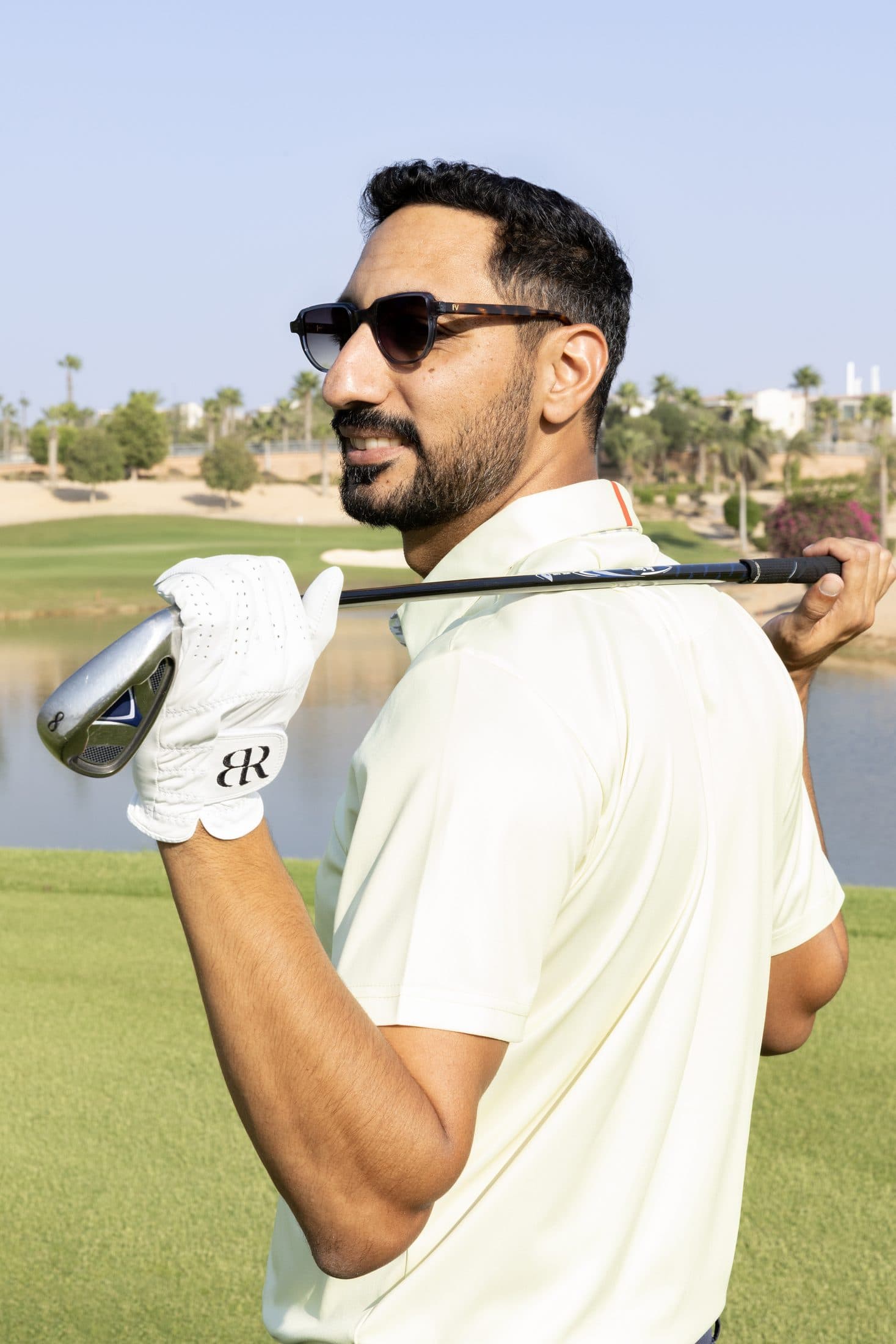 Ahmed Gheith on the course, club over his shoulder